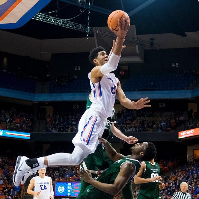 A basketball player leaps for two points